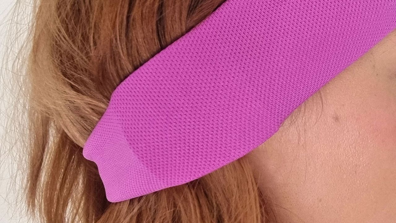 A close-up picture of our reviewer testing the AcousticSheep SleepPhones V8