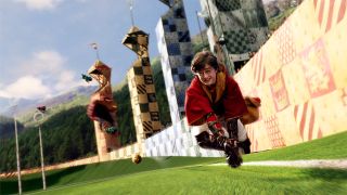 Daniel Radcliffe flying a broom during a Quidditch match as Harry Potter in Harry Potter and the Sorcerer's Stone