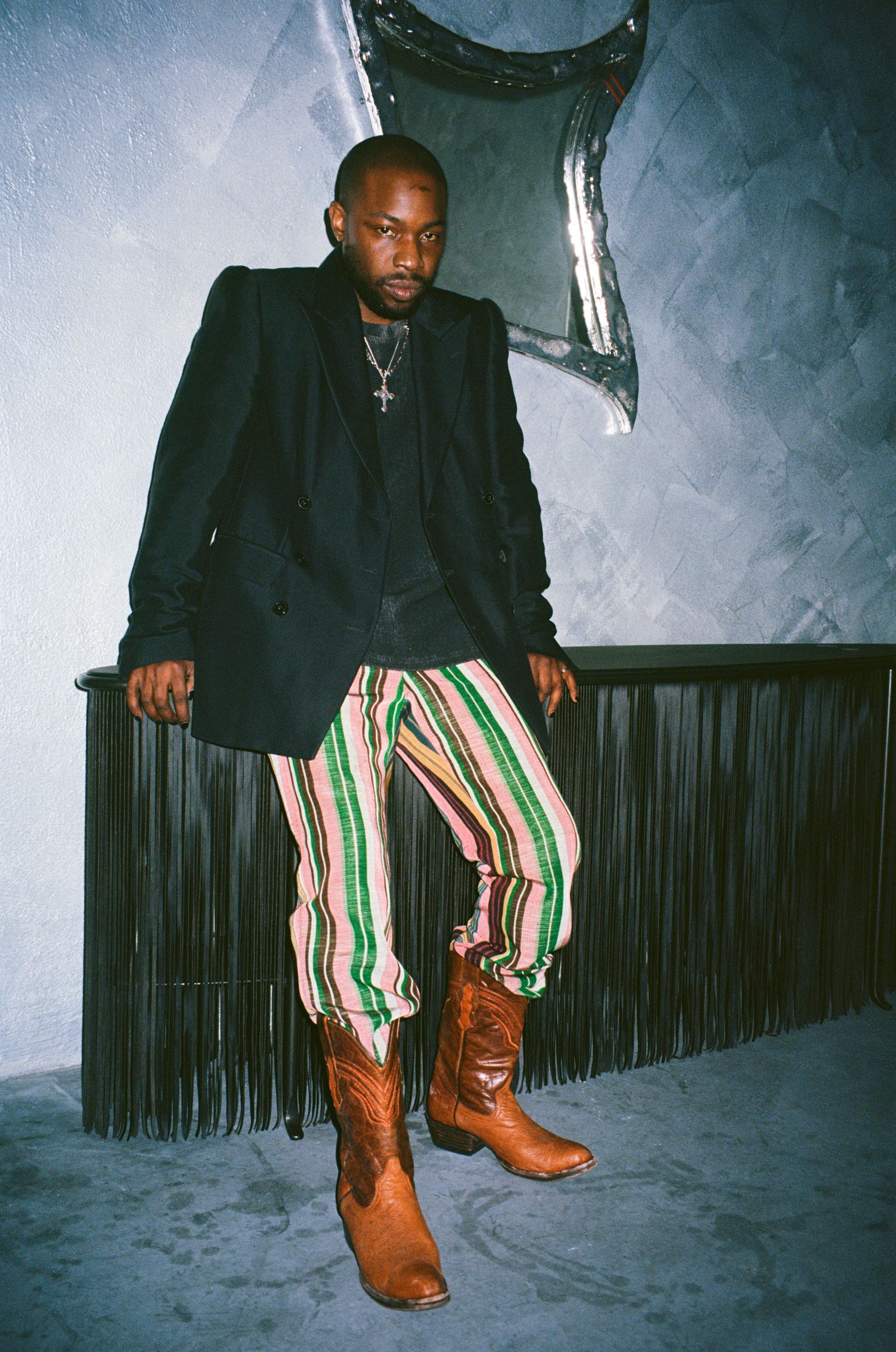 Dozie Kanu with a fringed console table for Knoll