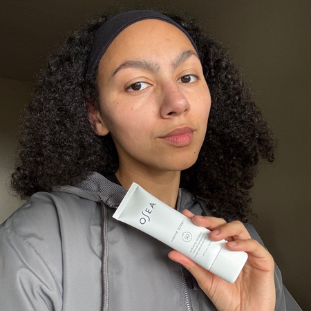 Assistant beauty editor Sabrina Talbert holding Osea's Marine Screen SPF 50 Mineral Sunscreen