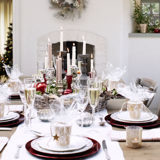 christmas dining table with candles and decorations