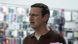 Ron at phone business in The Chair Company