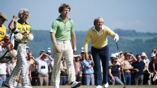 Tom Watson of the USA marches ahead of Jack Nicklaus of the USA off the 14th tee during the final round of the 1977 Open Championship on the Ailsa Course at Turnberry