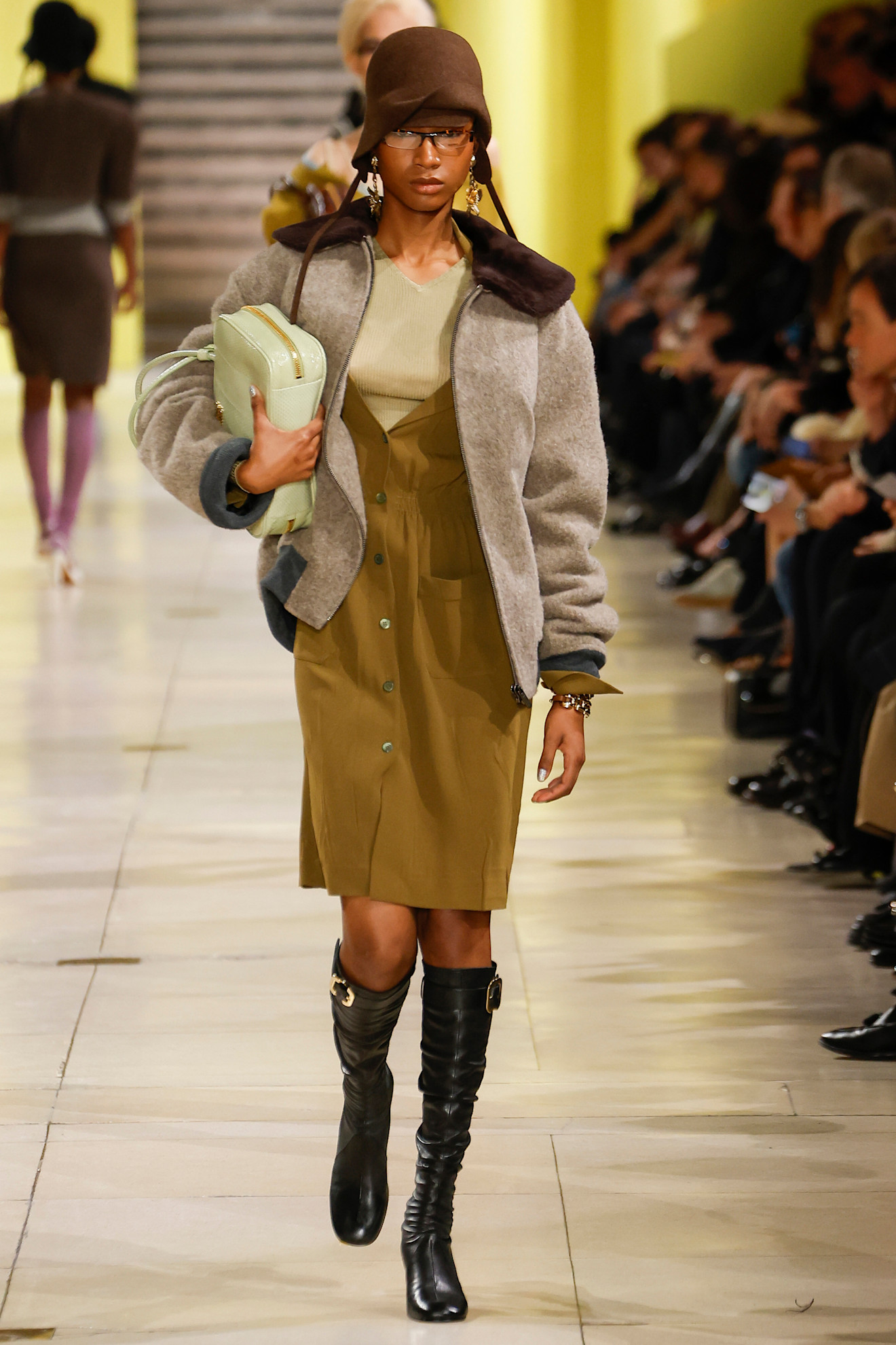A model wears a grey skirt and blazer with a giant tulip print on Marni&#039;s autumn/winter 2025 runway