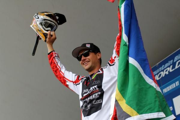 Greg Minnaar (Santa Cruz Syndicate) with a South African flag.
