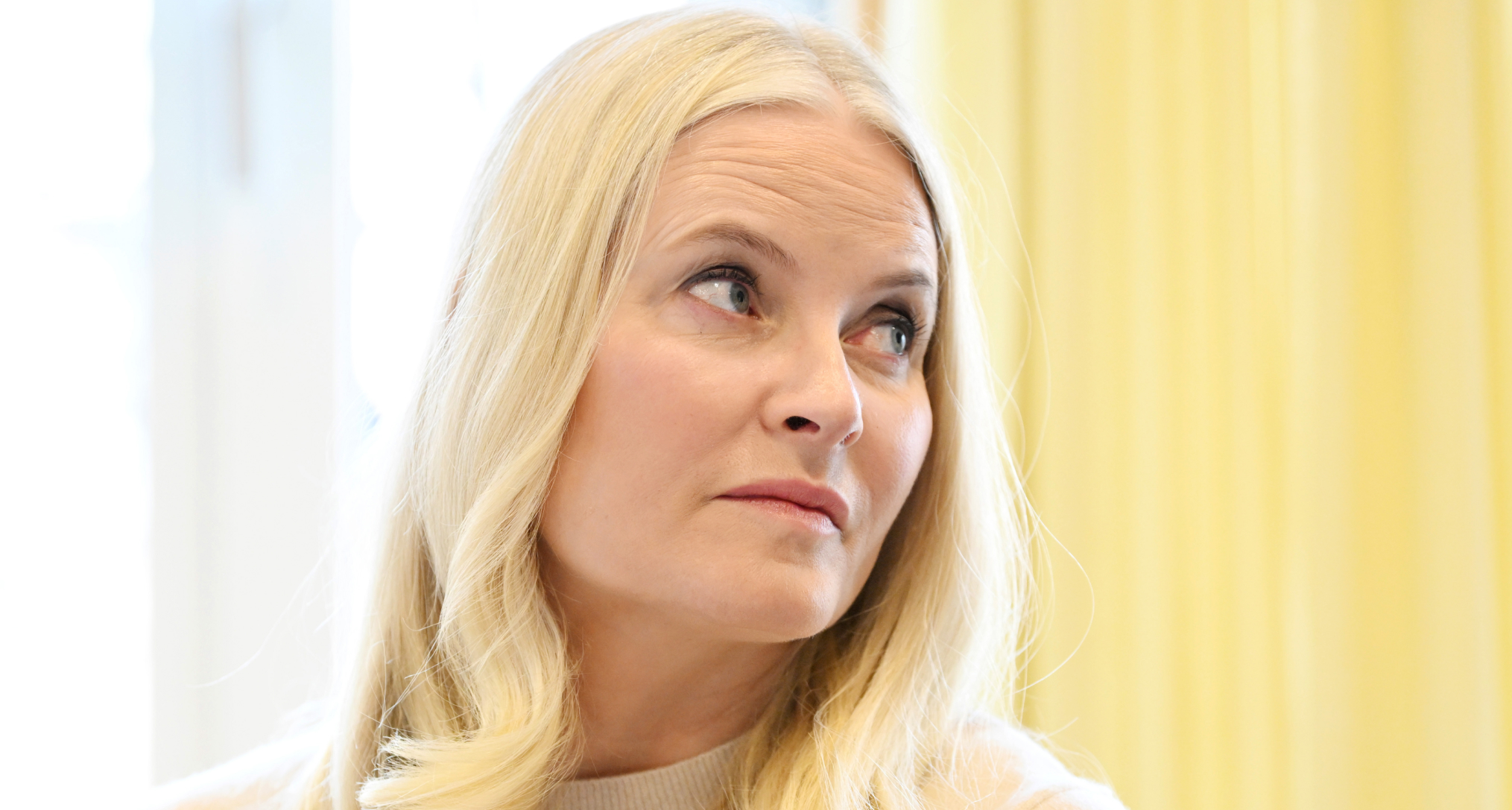 Crown Princess Mette-Marit looking to the right