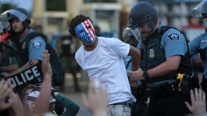 minneapolis, minnesota may 31 a demonstrator is arressted during a protest against police brutality and the death of george floyd, on may 31, 2020 in minneapolis, minnesota protests continue to be held in cities throughout the country over the death of george floyd, a black man who died while in police custody in minneapolis on may 25 photo by scott olsongetty images