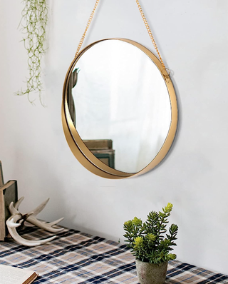 gold round hanging wall mirror