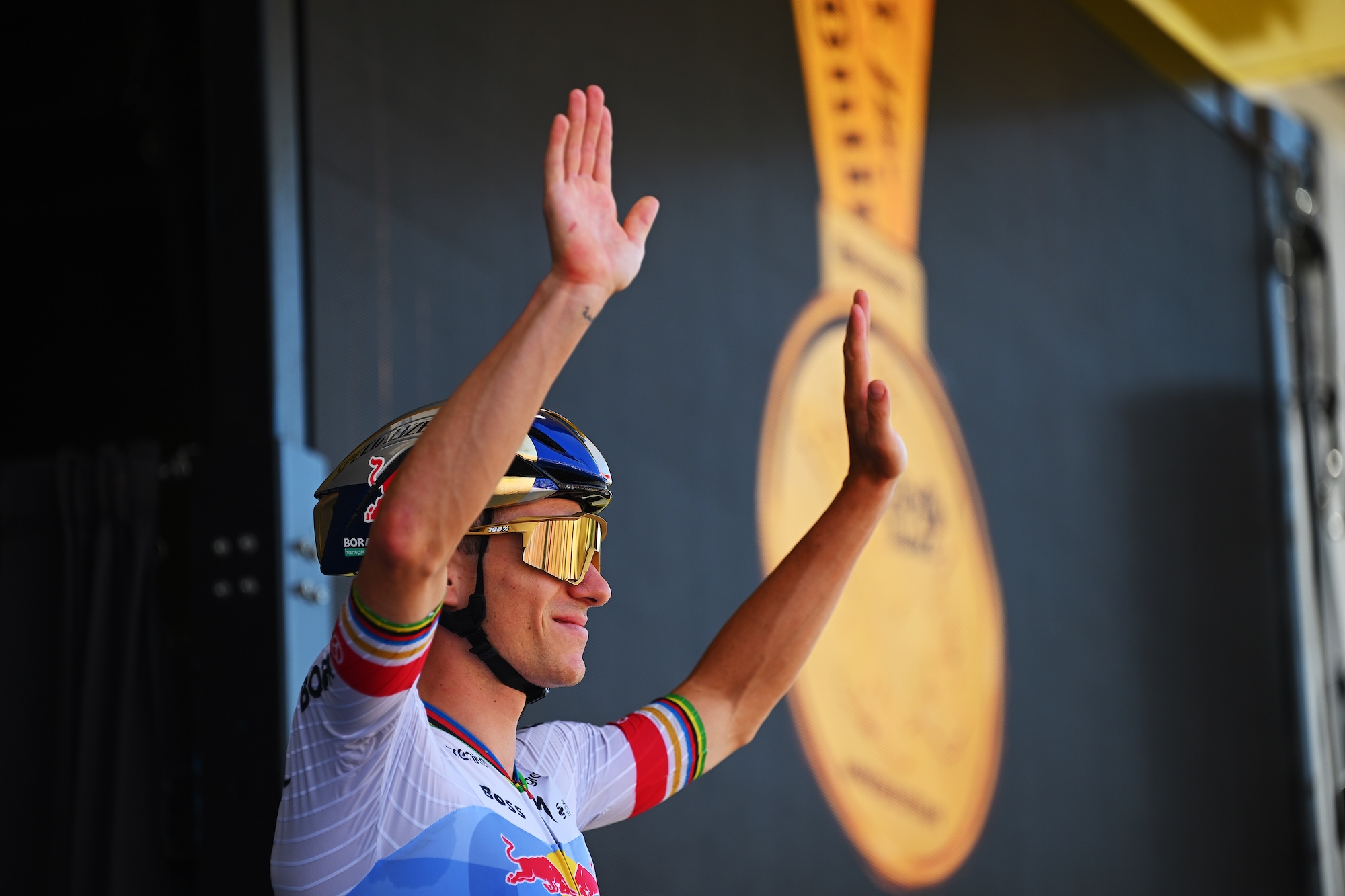 Evenepoel waves from the podium before stage 17 of the Tour de France