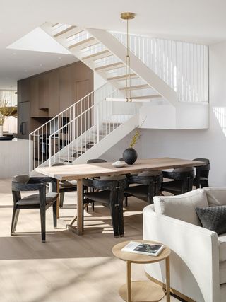 open plan dining room with an open staircase