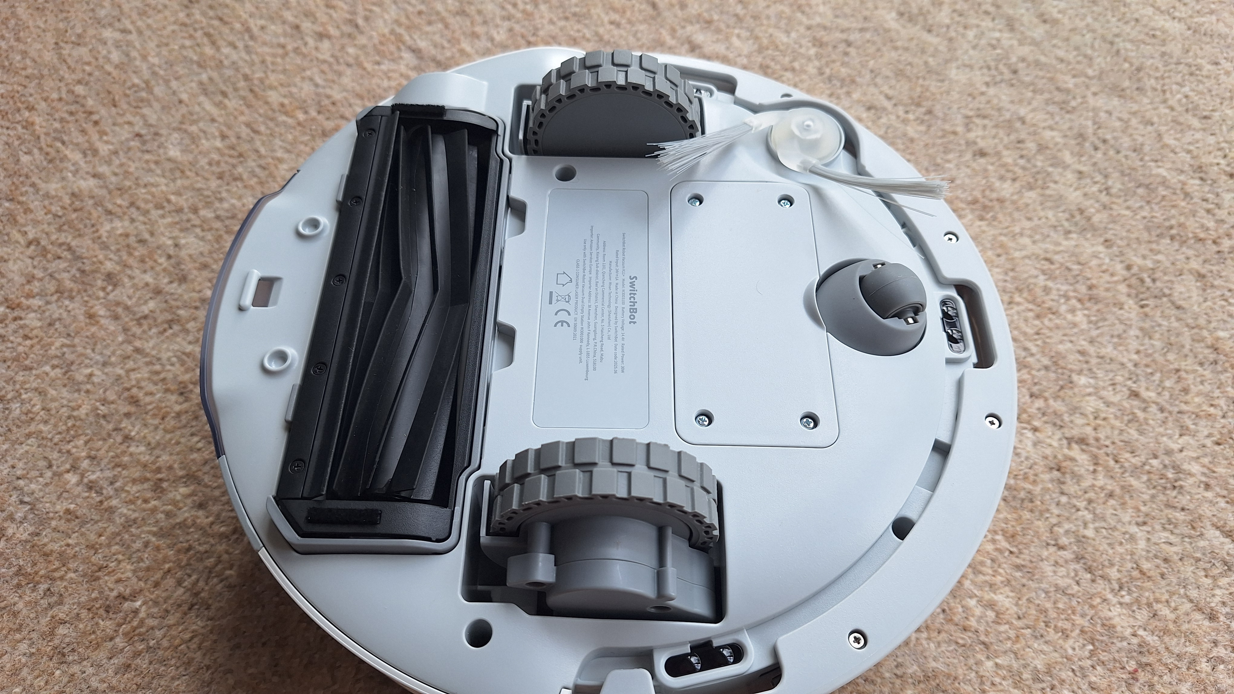 SwitchBot K11+ robot vacuum flipped over to show underside
