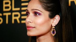 A close-in shot of Freida Pinto wearing one of the key fall makeup looks, amethyst eyes