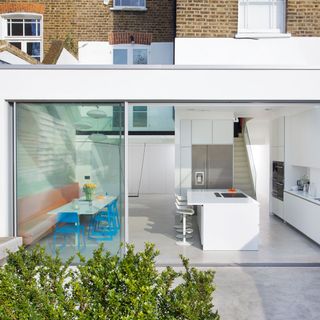Garden exterior glass extension with kitchen inside