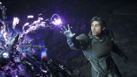 Screenshot from an Exodus trailer, showing a white man reach out to a glowy alien object in a dark room.