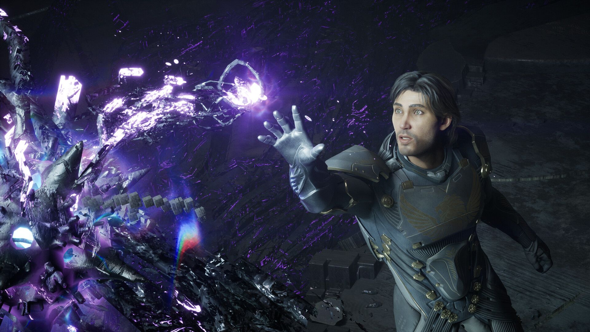 Screenshot from an Exodus trailer, showing a white man reach out to a glowy alien object in a dark room.