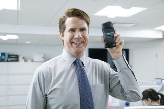 Will Ferrell holding up deodorant in an office in an snl sketch