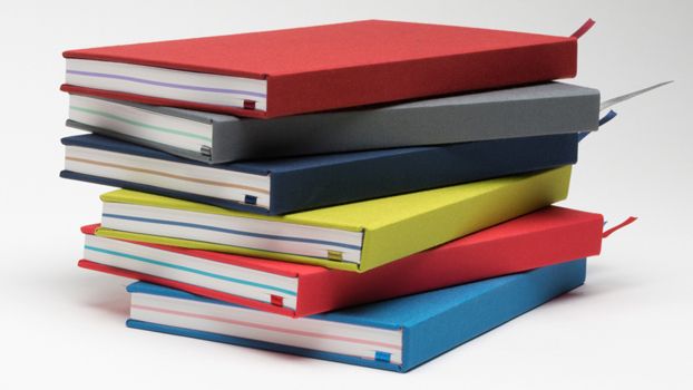 A stack of colourful notebooks