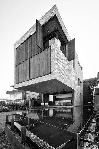 The house was built with five key materials: concrete, stone, timber, glass and steel