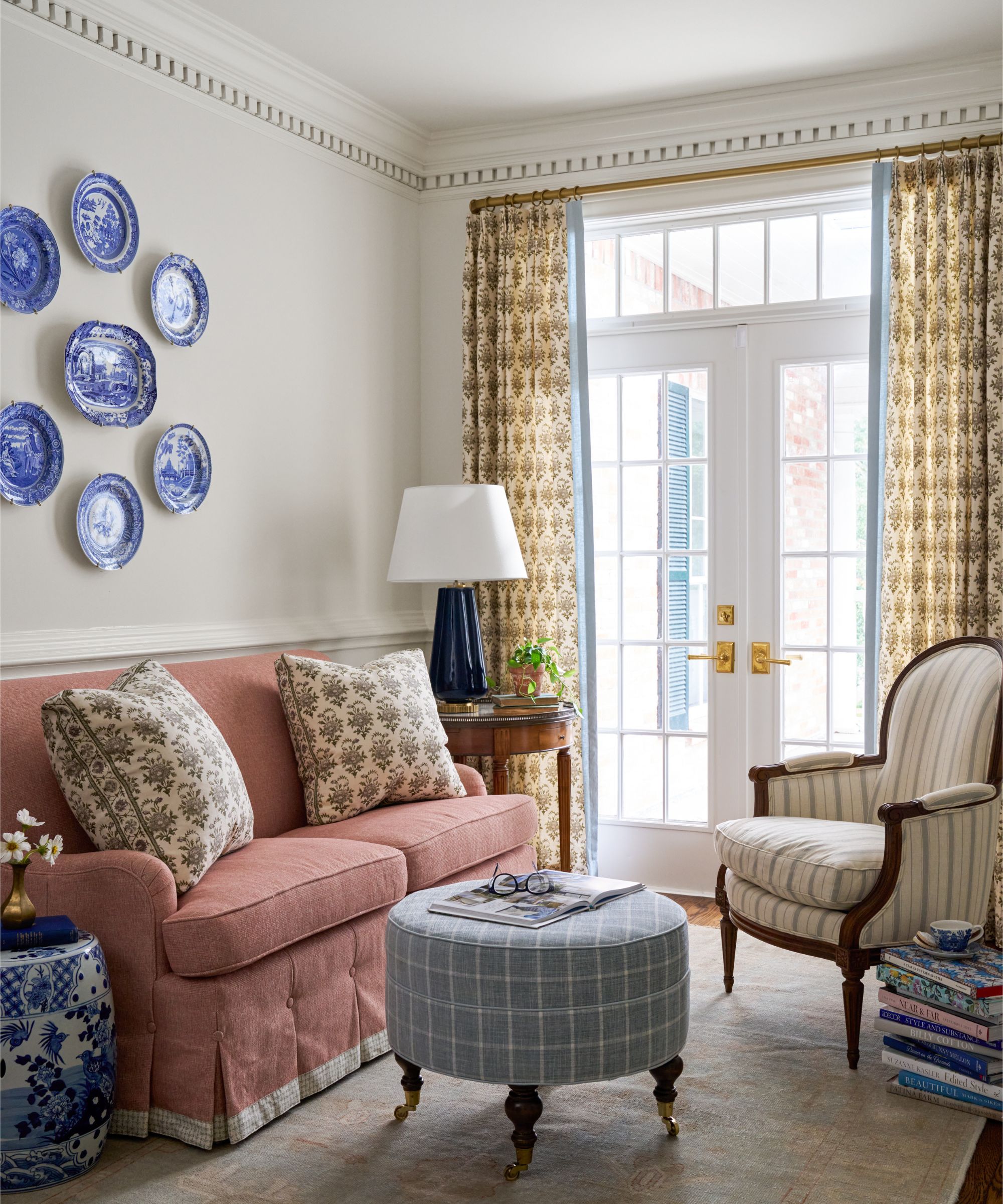 Katie Davis Design sitting room with vintage blue and white china displayed on the wall