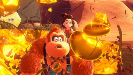 DK and Pauline stare at an explosion of gold in Donkey Kong Bananza