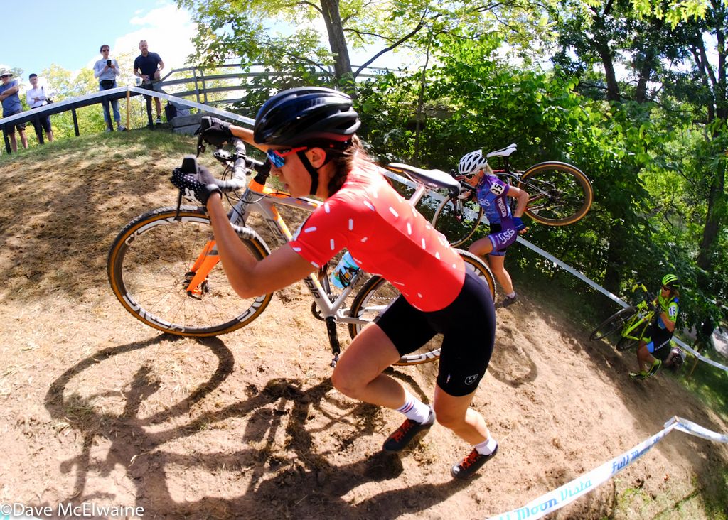 Sophia Gomez Villafane (TenSpeed Hero) running a steep hill during lap two.