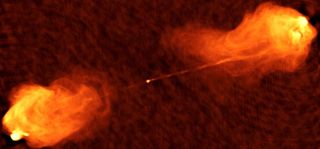 This radio image shows two jets shooting out of the center of Cygnus A, a galaxy not too far from our own. A new paper reports discovering a similar object in a much more distant, ancient galaxy. That galaxy has a bright, relatavistic jet emanating from its central supermassive black hole pointed at Earth, making it a blazar.