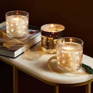 M&S light up candles on marble table