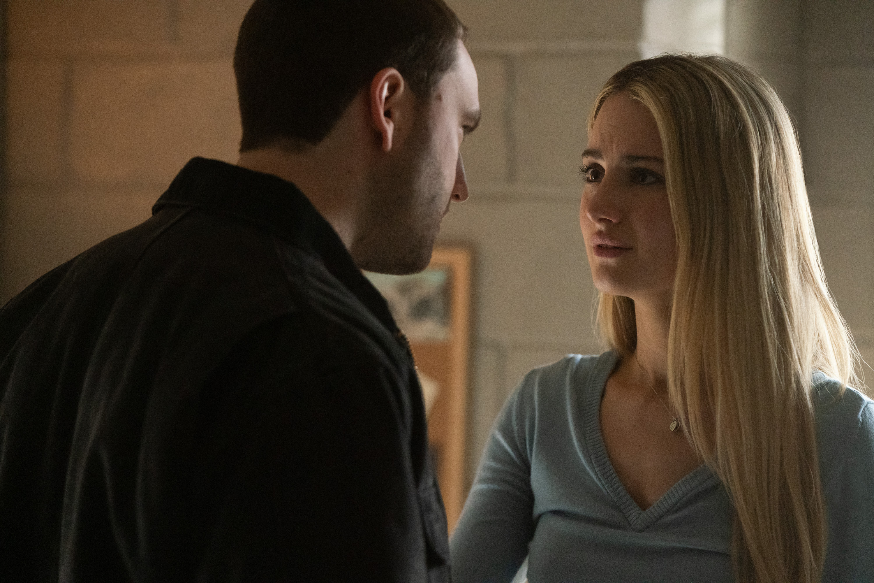 jackson white as stephen and grace van patten as lucy having an argument in a dorm room in tell me lies season 3