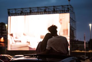 couple on a date at a drive in movie theater