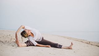 Yoga Teacher Lorraine Taylor performs a wide angle side fold
