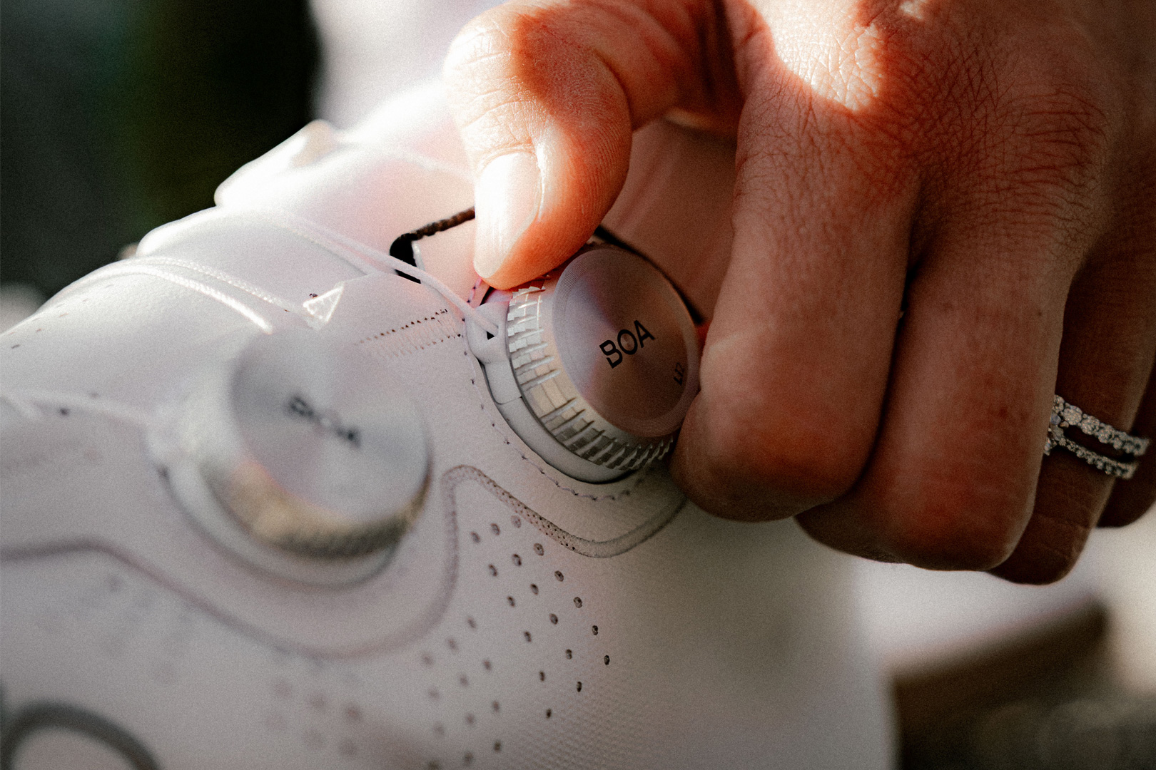 BOA dial being tightened on road cycling shoes