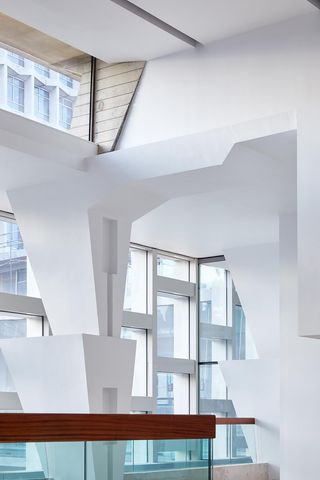Jiggered white pillars inside a building