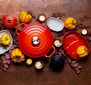 le casserole set and dishes with pumpkins