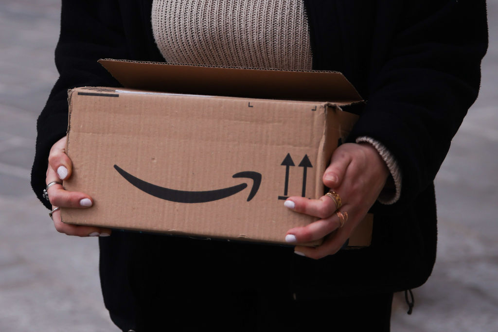 A person carries Amazon Prime paper box in Bologna, Italy on March 13th, 2025