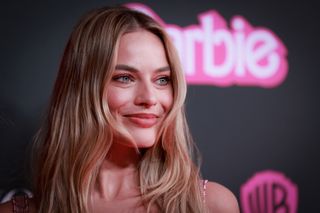 Closeup of Margot Robbie on the "Barbie" red carpet