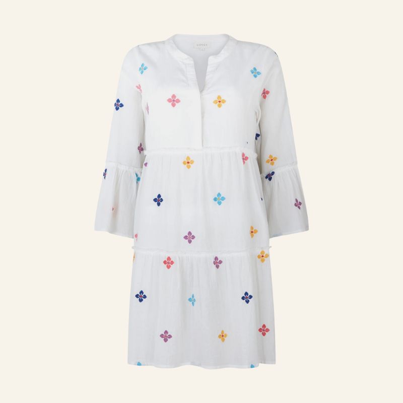 A cutout of a white kaftan with embroidery by Aspiga