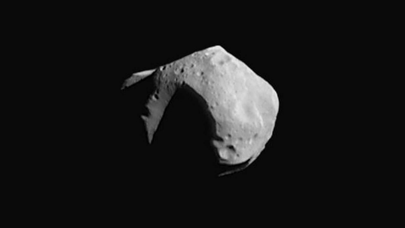 A gray rock floating over a dark background