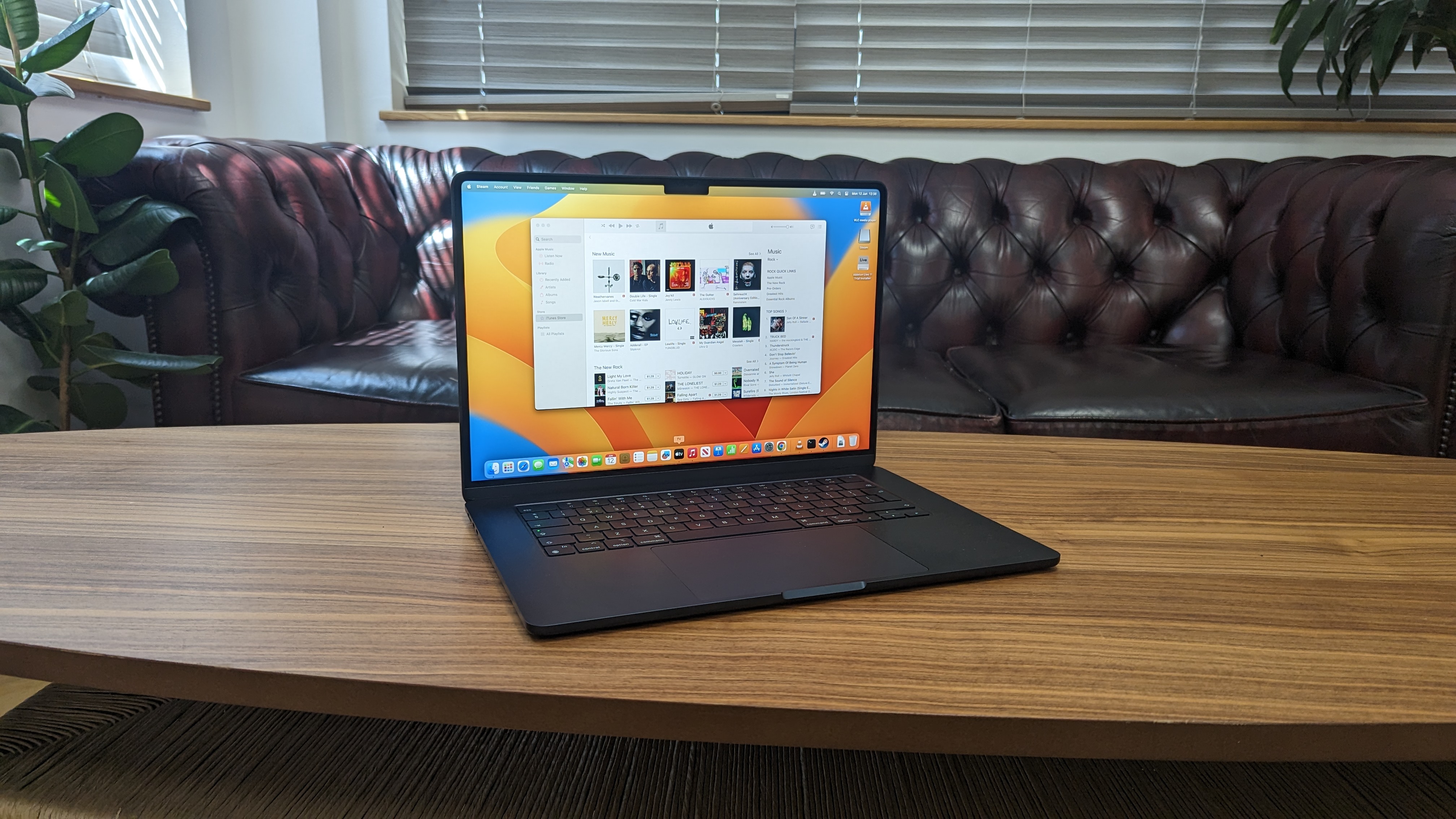 15-inch MacBook Air on wooden table at home