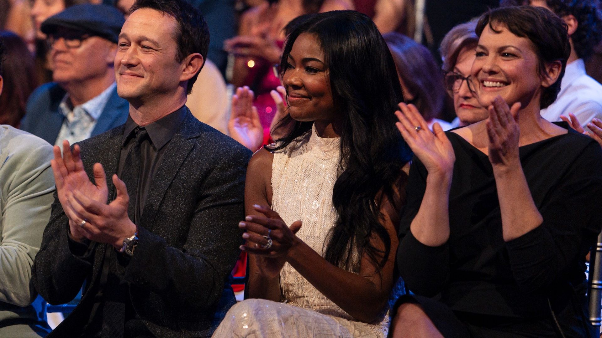 The 10 Things I Hate About You Cast clapping in the audience on the DWTS stage.