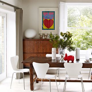 neutral dining room with dining table and chairs