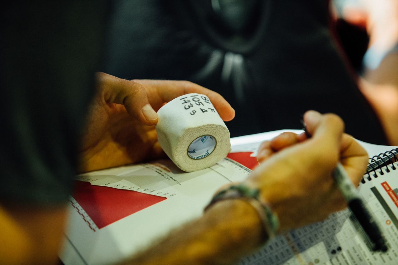 Joey Rosskopf prepares bar tape with key points on the stage.