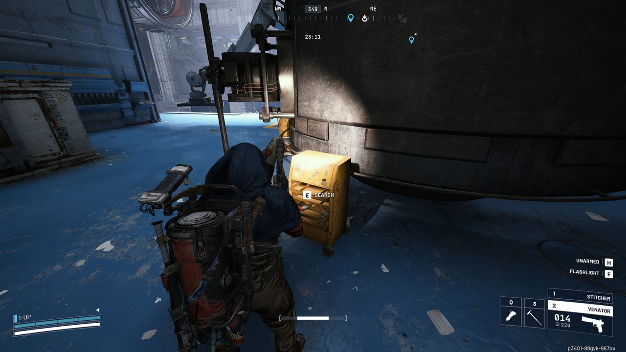Arc Raiders Geiger Counter: A player looking at a yellow toolbox in the Assembly Workshop using a flashlight.