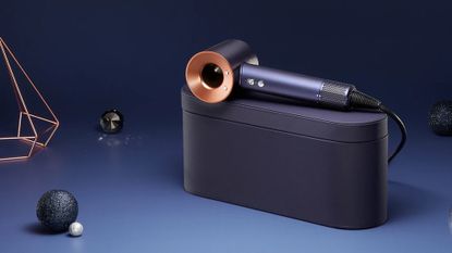 The new Dyson Christmas Supersonic hairdryer is copper and navy