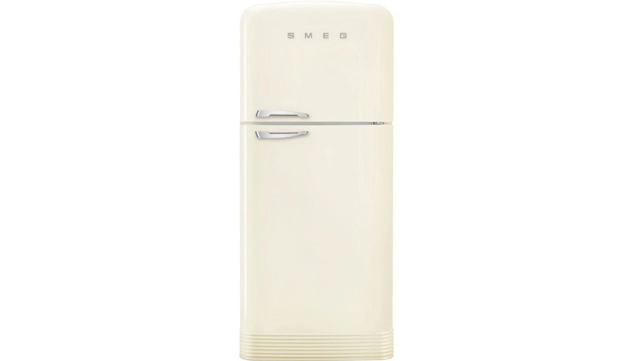 A cream and silver chrome Smeg fridge on a white background