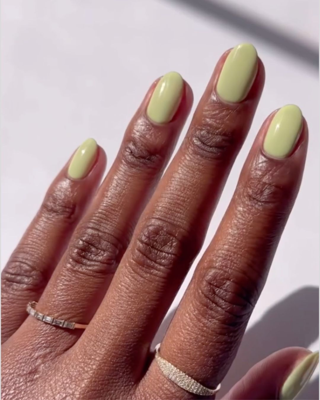 Light sage green nails.