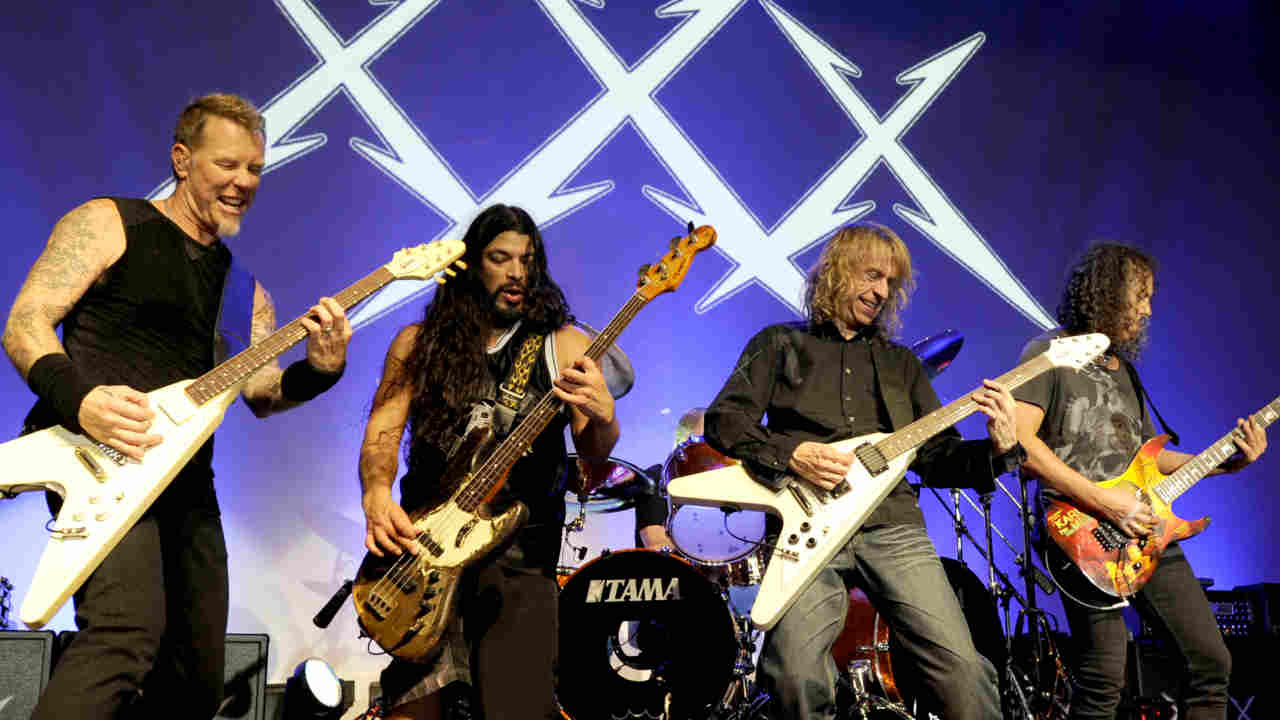 Diamond Head&amp;rsquo;s Brian Tatler performing onstage with Metallica in 2011