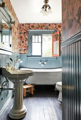 bathroom with blue paneling and House of Hackney pink wallpaper