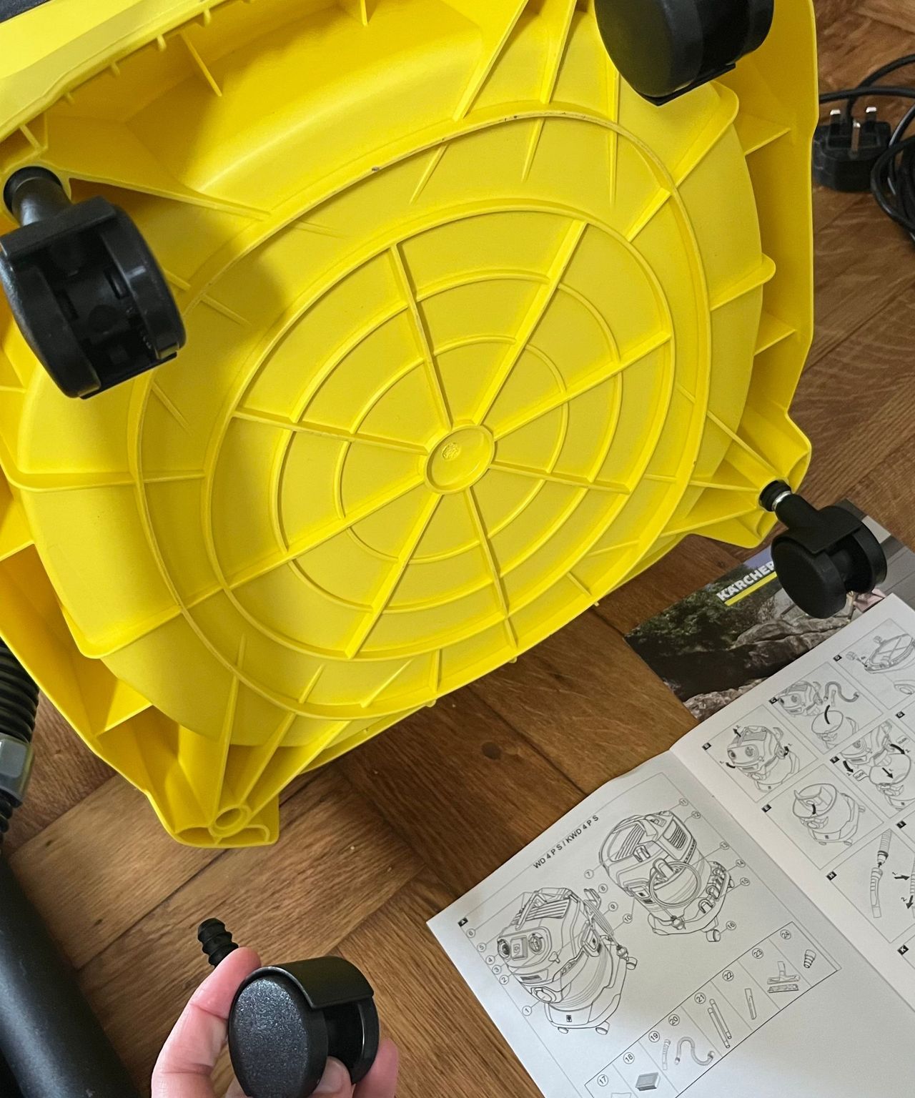 As part of the set up, the Karcher WD4 will need to have all four wheels secured to the container base