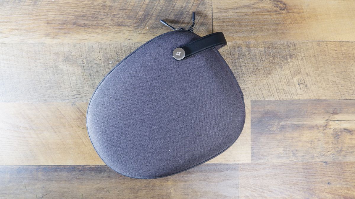 Spigen Klasden AirPods Max Case in gray on a wooden floor