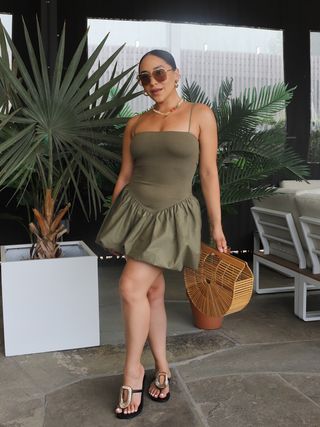 Amanda Korina Wearing Olive Green Dress and Black Sandals